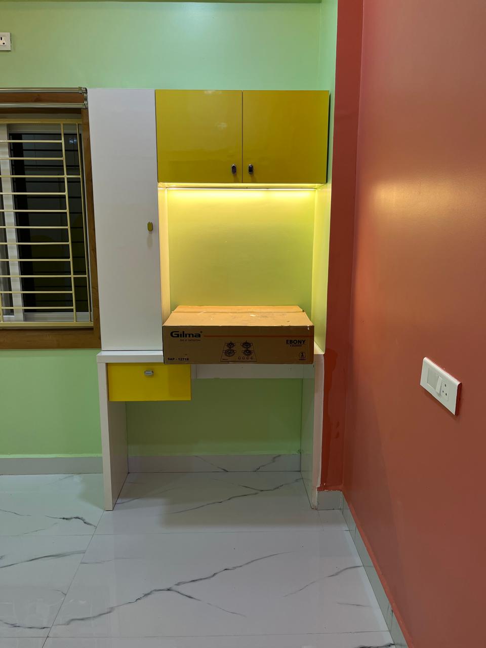 Manibhushan's House, Hyderabad — Compact study nook with backlit shelving