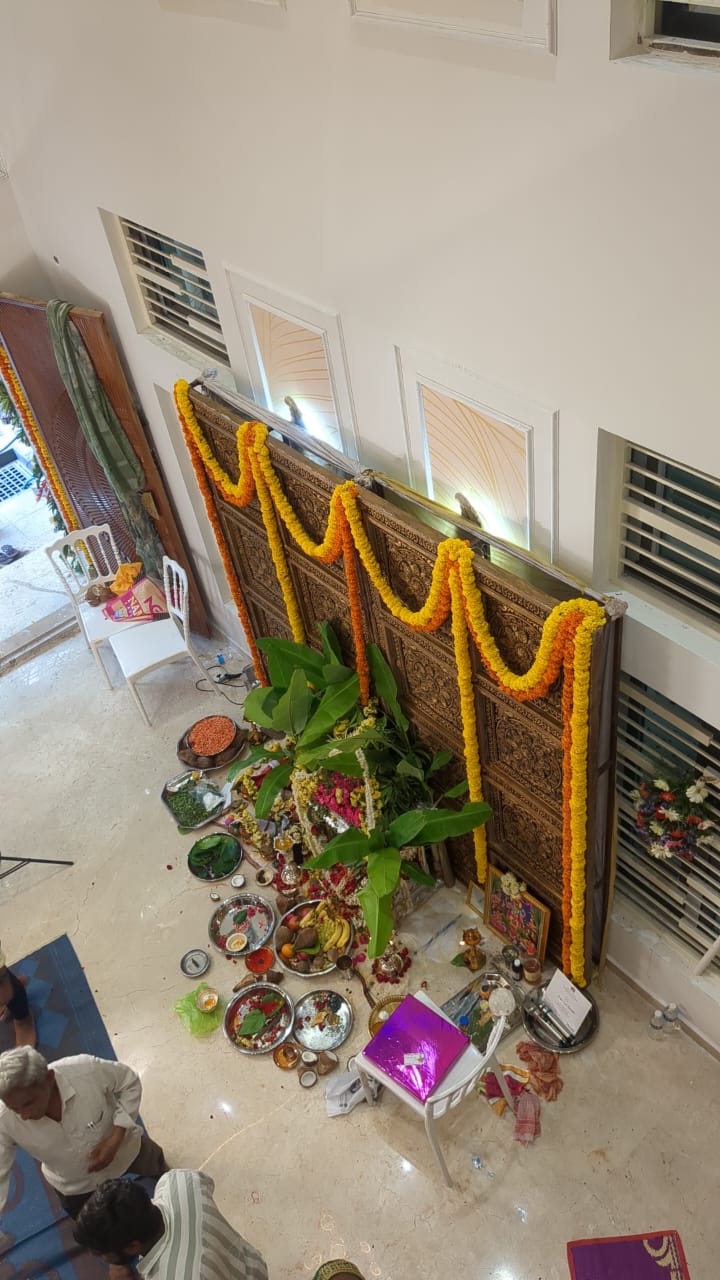 Ajay's House, Ballari — Carved teak main door at the double-height foyer