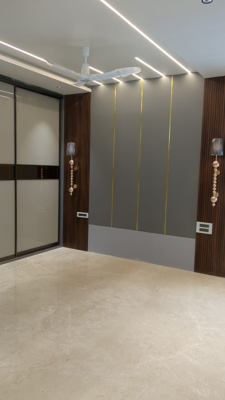 Ajay's House, Ballari — Master bedroom with fluted wood panelling and profile lighting